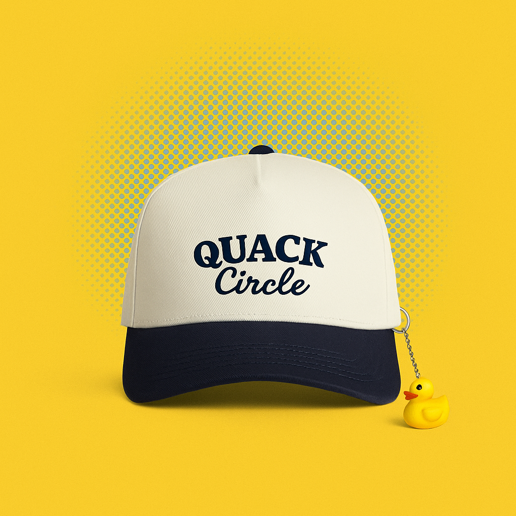 White cap with navy bill and 'QUACK Circle' text on a yellow background